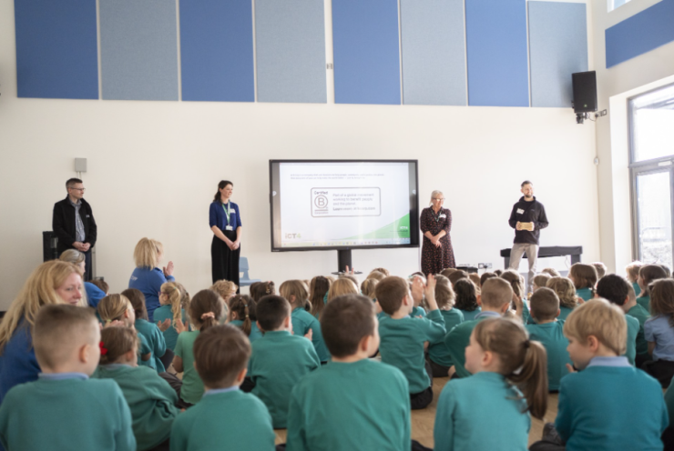 iCT4 staff doing an assembly in front of children at sky Primary, telling them all about what it means to be a B Corporation.